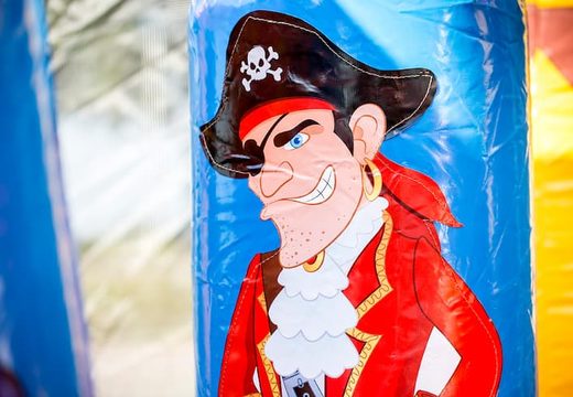 Order a large Indoor pirate bouncer with a slide on the jumping surface, climbing tower and fun obstacles in pirate themed with prints for kids. Buy bouncers online at JB Inflatables UK