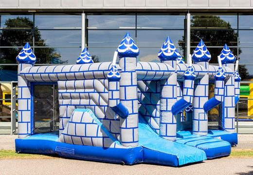 Buy a large Indoor castle bouncy castle with a slide on the jumping surface, climbing tower and fun obstacles with prints, for kids. Order bouncy castles online at JB Inflatables UK.