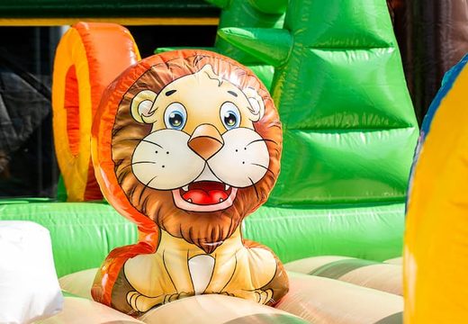 Mega inflatable jungle bouncer with slides, 3D objects, crawl tunnel and climbing tower for children. Order bouncers online at JB Inflatables UK