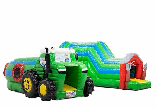 Crawl tunnel tractor bouncy castle with obstacles, a climbing slope and sliding slope for kids. Buy bouncy castles online at JB Inflatables UK
