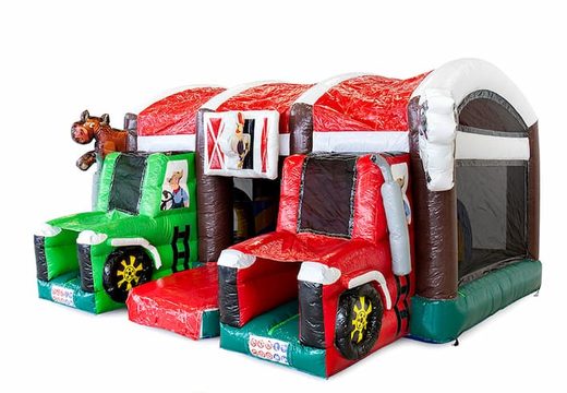 Buy a large indoor inflatable multiplay bouncy castle with slide in a farm tractor theme for children. Order bouncy castles online at JB Inflatables UK