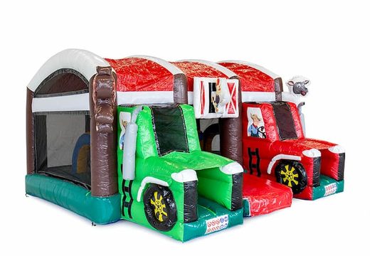 Multiplay XXL Farm bouncy castle in a unique design with two entrances, a slide in the middle and 3D objects for kids. Buy bouncy castles online at JB Inflatables UK
