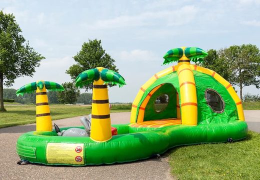 Buy a semi-open playzone jungle bouncy castle with plastic balls and 3D objects for children. Order bouncy castles online at JB Inflatables UK