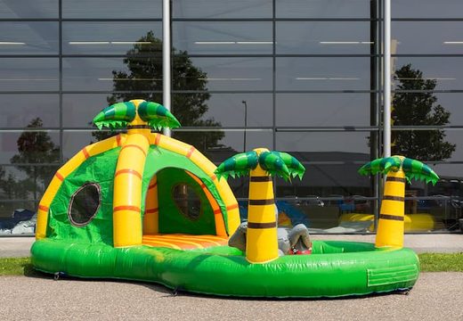 Playzone jungle bouncy castle with plastic balls and 3D objects for children. Buy bouncy castles online at JB Inflatables UK
