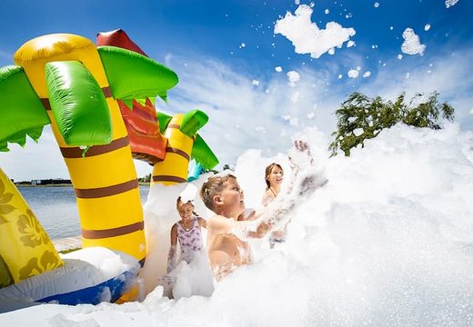 Open Bubble park Hawaii with a foam tap for kids to use. Order inflatable bouncers at JB Inflatables UK