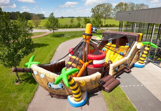 Buy Mega Pirate Shooter ship shape bouncer with cannon, game and slide for kids. Order bouncers online at JB Inflatables UK