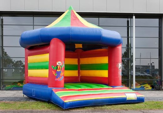 Standard carousel bouncy castle for sale in circus theme for children. Buy indoor bouncy castles online at JB Inflatables UK