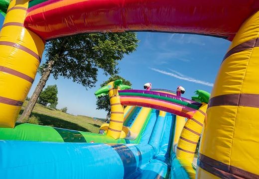 Order Drop & Slide Jungle Bouncy Castle with slides for children. Buy bouncy castles online at JB Inflatables UK