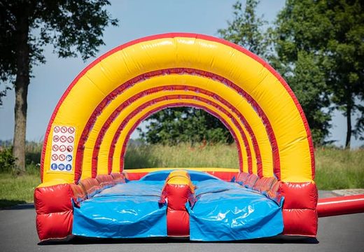 Spectacular inflatable double slide slide 20m long with an extra wide track for children. Buy inflatable belly slides now online at JB Inflatables UK
