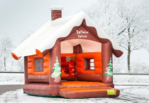 Standard Skihut winterworld bouncy castle with a 3D chimney on top for children. Buy indoor inflatable bouncy castles online at JB Inflatables UK