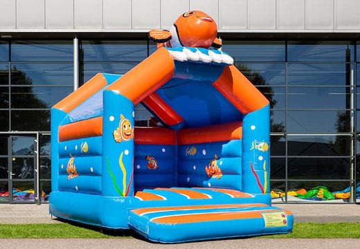 Order standard party bouncy castles in striking colors with a large 3D clownfish object on top for children. Bouncy castles for sale online at JB Inflatables UK