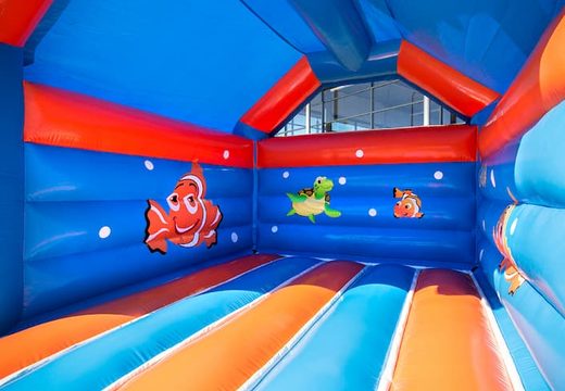 Buy standard party bounce houses in striking colors with a large 3D clownfish object on top for children. Buy bounce houses online at JB Inflatables UK
