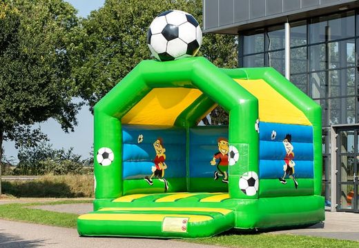 Standard bouncy castles for sale in striking colors with a large 3D object in the shape of a football for children on top. Buy indoor bouncy castles online at JB Inflatables UK