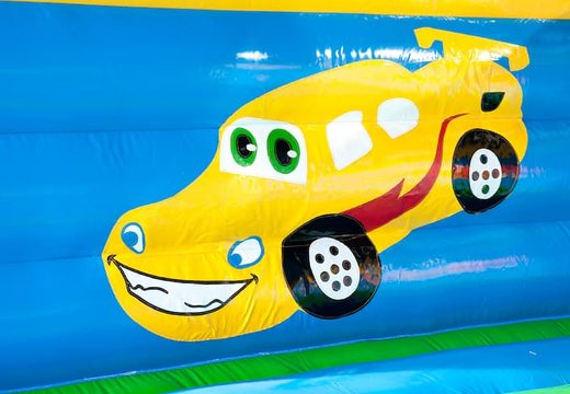 Big super bounce house covered with cheerful animations in car theme for children. Order bounce houses online at JB Inflatables UK