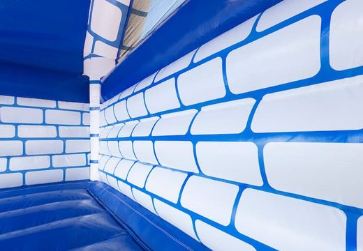 Buy a large covered blue and white bouncy castle in castle theme for children. Order inflatables online at JB Inflatables UK