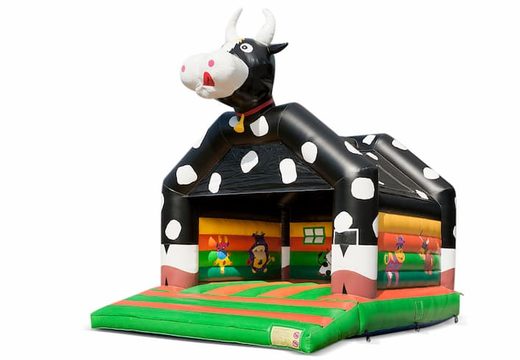 Big inflatable bouncy castle with roof in cow theme for sale for kids. Available at JB Inflatables UK online