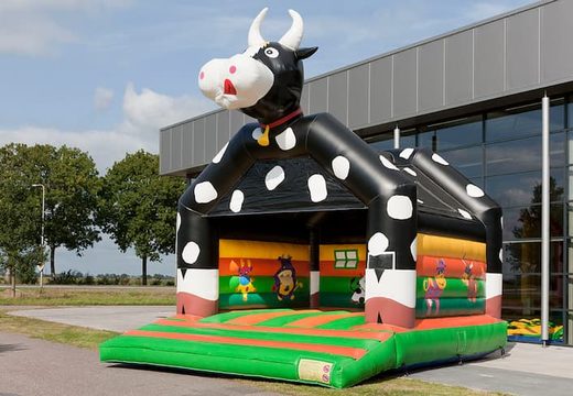 Cow super bouncy castle with cheerful animations for kids.  Order online bouncy castles at JB Inflatables UK