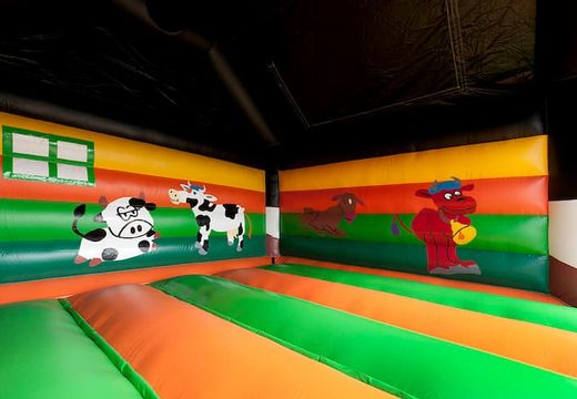 Big inflatable bounce house with roof in cow theme to buy for kids. Order online bounce houses at JB Inflatables UK