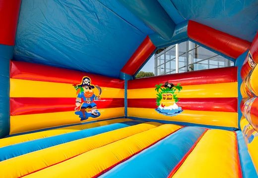 Big super bounce house covered with cheerful animations in pirate theme for children. Order bounce houses online at JB Inflatables UK