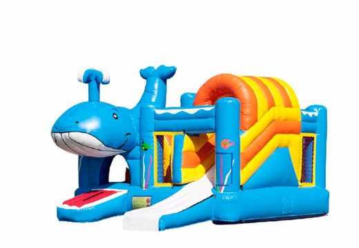 Buy an inflatable multiplay bouncy castle and obstacles in a whale theme with slide for children. Order inflatable bouncy castles online at JB Inflatables UK