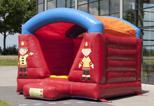 Inflatable bouncy castle covered in red with fire brigade theme for sale for children