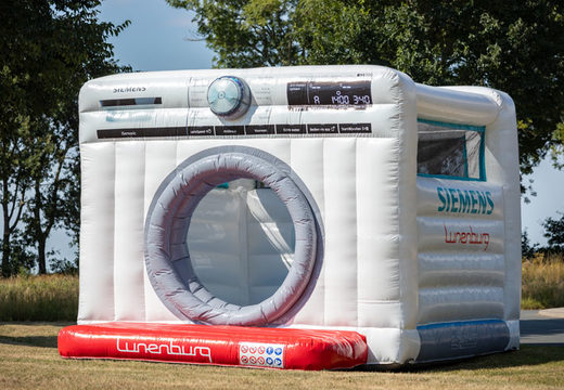 Custom made bouncy castle in the shape of a washing machine from Siemens as an eye-catcher promotion means