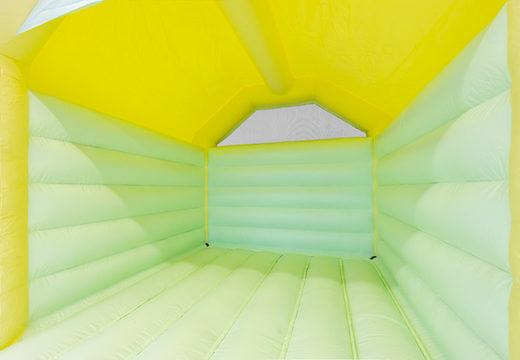 Order A Frame bouncy castle in pastel colors yellow green for children. Inflatables for sale online at JB Inflatables UK