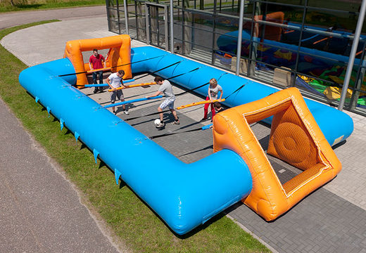 Buy inflatable blue orange table football with unique boarding sliding system for kids. Order inflatable table football now online at JB Inflatables Netherlands