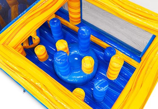 Pillars and crawl hole in yellow and blue inflatable obstacle course